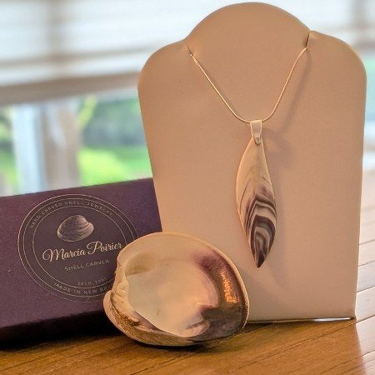 Hand carved quahog shell pendant by Marcia Poirier
